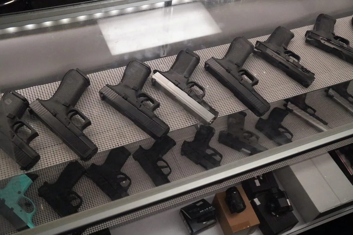A shelf full of handguns at Paladin Protection Academy, a gun store and concealed carry training business in Kenosha, Wis., on Nov. 20, 2021. (Jackson Elliott/The Epoch Times)