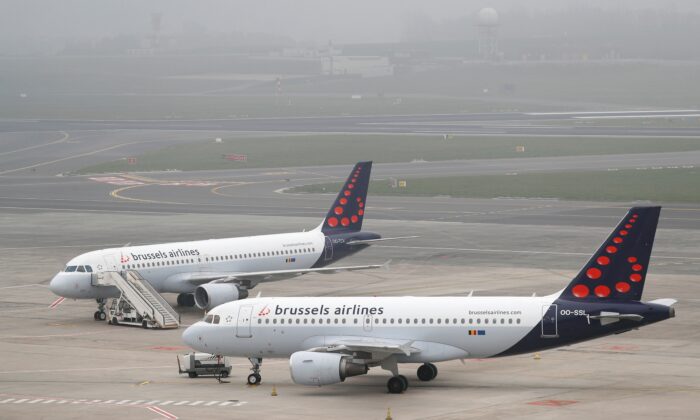 Brussels Airlines planes are parked on the tarmac at Zaventem International Airport near Brussels, Belgium, on March 19, 2020. (Francois Lenoir/Reuters)