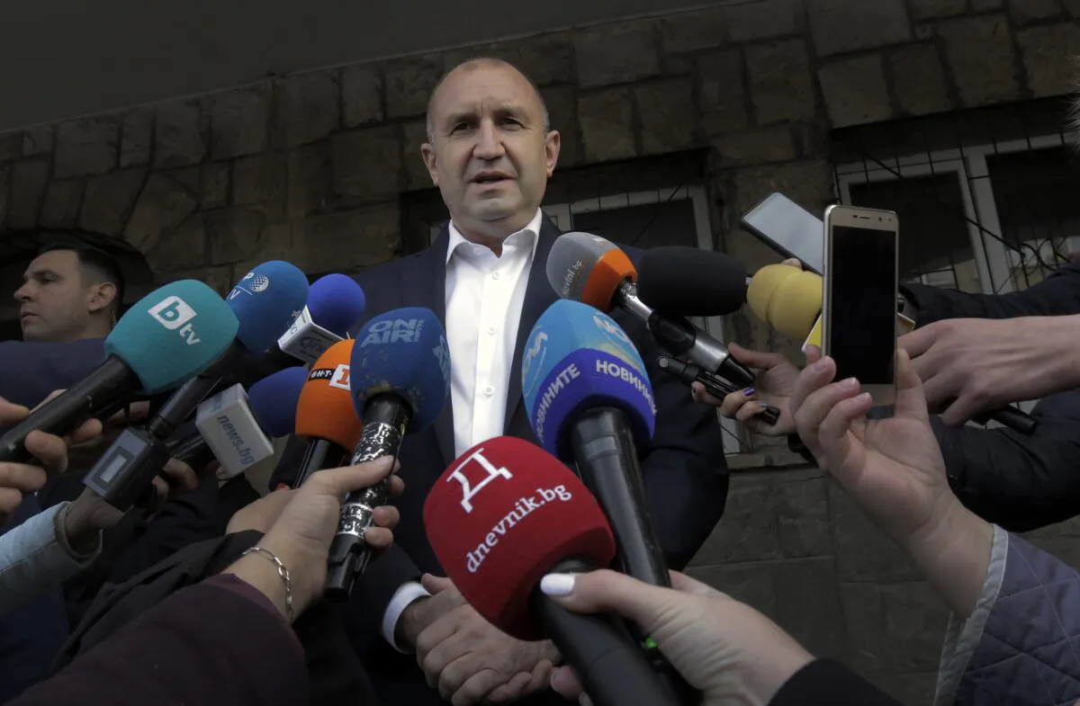 Bulgarian President Rumen Radev speaks to journalists after casting his vote in Sofia, on Nov. 21, 2021. (Valentina Petrova/AP Photo)