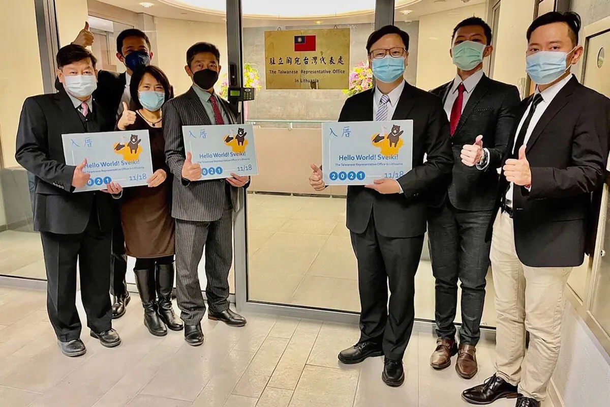 Staff outside the Taiwan Representative Office in Vilinius, Lithuania, on Nov. 18, 2021. (Taiwan Ministry of Foreign Affairs via AP)