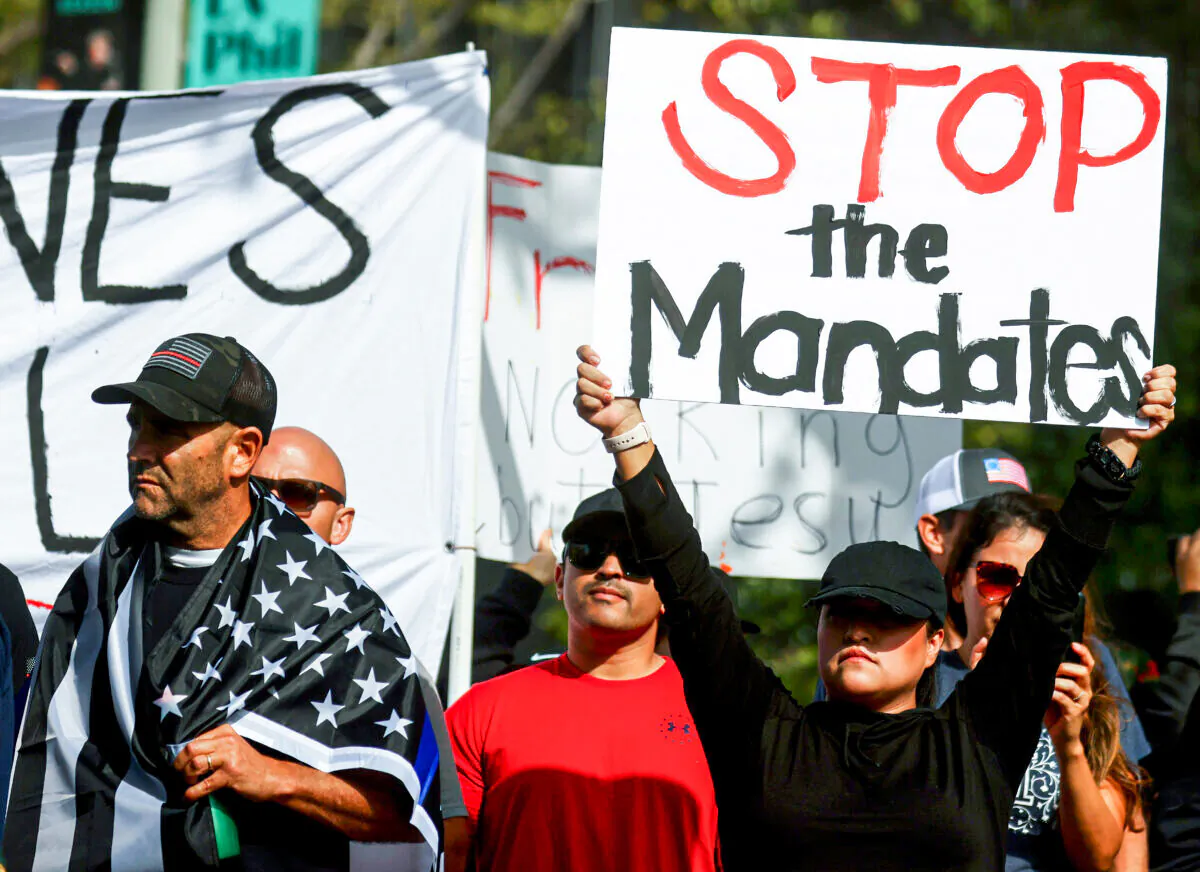 Protestors gather in Grand Park outside City Hall at a March for Freedom rally demonstrating against the L.A. City Council’s COVID-19 vaccine mandate for city employees and contractors in Los Angeles, Calif., on Nov. 8, 2021. (Mario Tama/Getty Images)