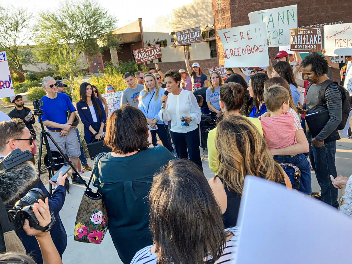 Kari Lake, a Republican candidate for Arizona governor, speaks before a crowd of parents demanding the resignation of Scottsdale Unified School District Board member Jann-Michael Greenburg, on Nov. 15, 2021, outside of district offices in Scottsdale. Greenburg is accused of keeping an online dossier on parents who oppose board policies, such as Critical Race Theory and mask mandates. (Allan Stein/The Epoch Times)