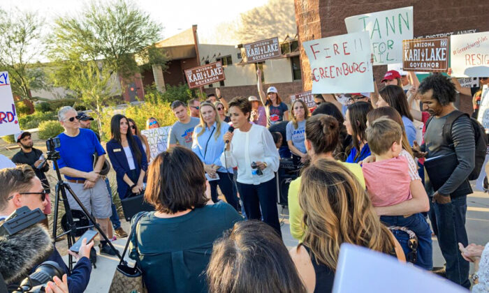 Kari Lake, a Republican candidate for Arizona governor, speaks before a crowd of parents demanding the resignation of Scottsdale Unified School District Board member Jann-Michael Greenburg, on Nov. 15, 2021, outside of district offices in Scottsdale. Greenburg is accused of keeping an online dossier on parents who oppose board policies, such as Critical Race Theory and mask mandates. (Allan Stein/The Epoch Times)