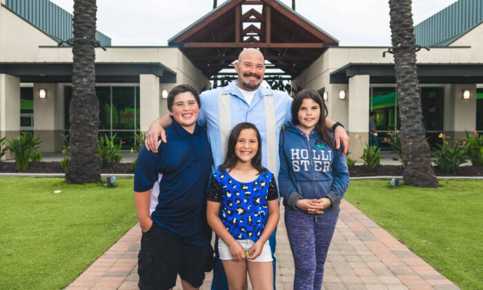 Chuck Pelser and his three children at the Orange County Rescue Mission Village of Hope in Tustin, Calif., in an undated photo. (Courtesy of Orange County Rescue Mission)