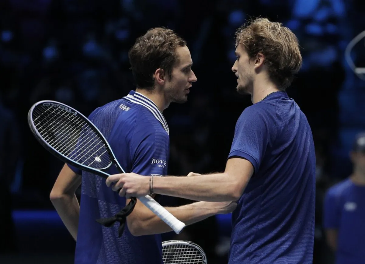 Russia's Daniil Medvedev shakes hands with Germany's Alexander Zverev after their final match of the ATP World Tour Finals, at the Pala Alpitour in Turin, Italy, on Nov. 21, 2021. (Guglielmo Mangiapane/Reuters)