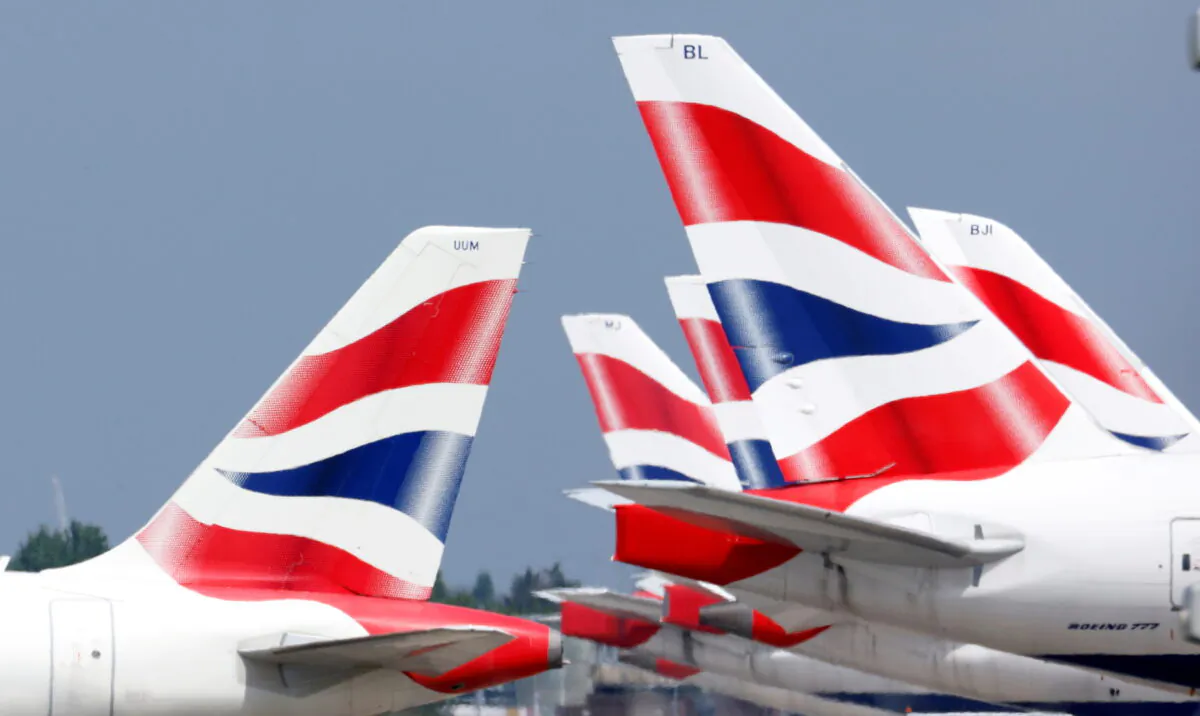 British Airways tail fins are pictured at Heathrow Airport in London, on May 17, 2021. (John Sibley/Reuters)