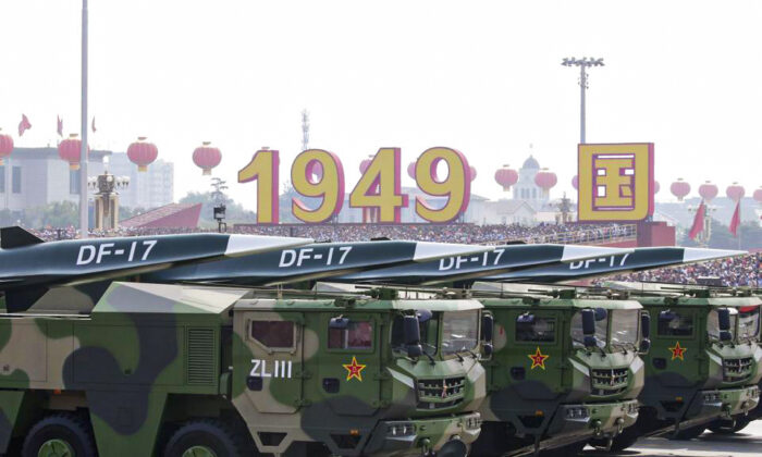 Military vehicles carrying hypersonic DF-17 missiles travel past Tiananmen Square during a military parade in Beijing on Oct. 1, 2019. (Jason Lee/Reuters)