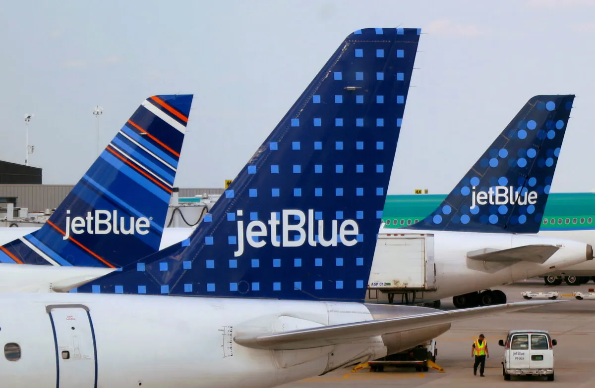 JetBlue Airways aircraft are pictured at departure gates at John F. Kennedy International Airport in New York on June 15, 2013. (Fred Prouser/REUTERS)