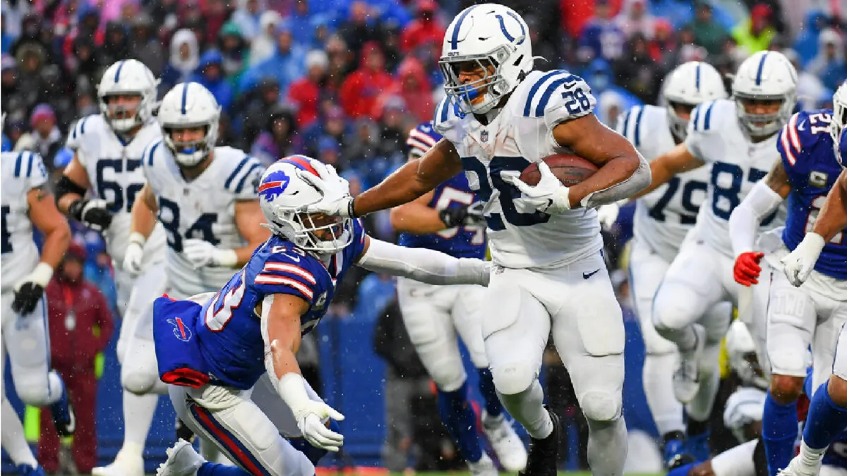 Indianapolis Colts running back Jonathan Taylor (28) stiff-arms Buffalo Bills safety Micah Hyde (23) on a run during the second half at Highmark Stadium in Orchard Park, N.Y., on Nov. 21, 2021. (Rich Barnes/USA TODAY Sports via Field Level Media)