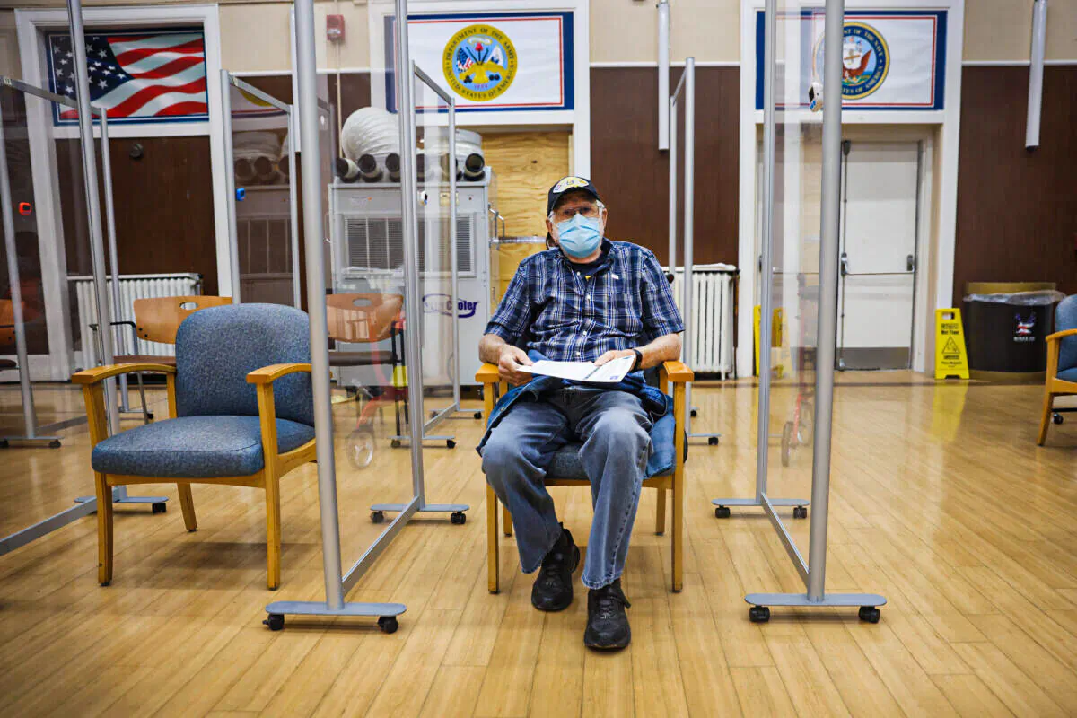 An Army veteran waits to see if he has a reaction after receiving a COVID-19 booster vaccine at a Veterans Affairs hospital in Hines, Ill., on Sept. 24, 2021. (Scott Olson/Getty Images)