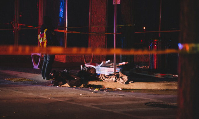 Debris litters the street at a crime scene in Waukesha, Wis., on Nov. 21, 2021. (Jim Vondruska/Getty Images)