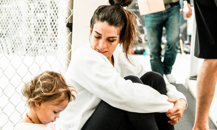 Mackenzie Dern takes a break from training with her daughter Moa, 2. (Courtesy Joseph Baura)