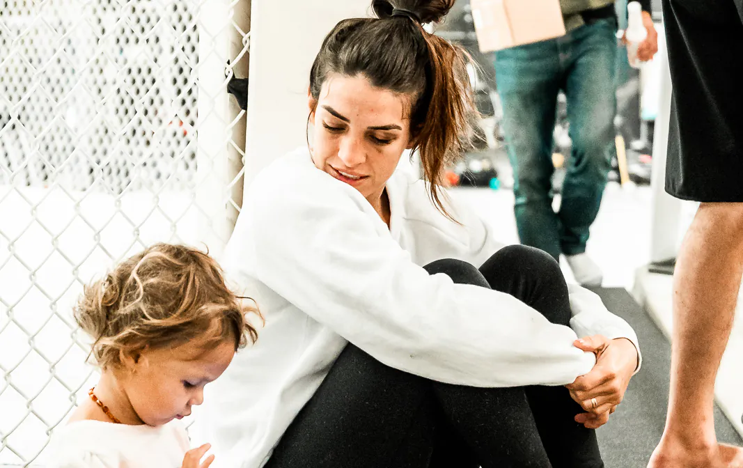 Mackenzie Dern takes a break from training with her daughter Moa, 2. (Courtesy of Joseph Baura)