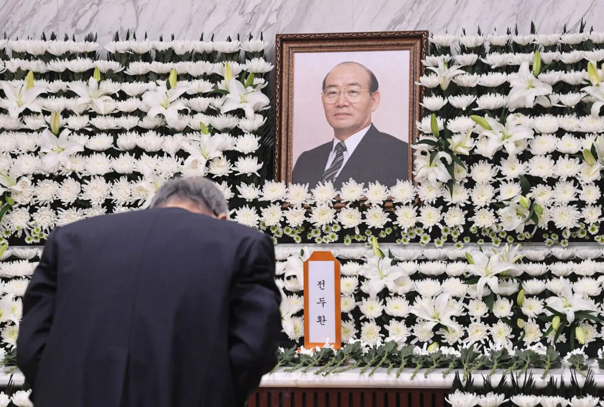 A man mourns during a funeral for late former South Korean President Chun Doo-hwan in Seoul, South Korea, on Nov. 23, 2021. (Yonhap/Reuters)