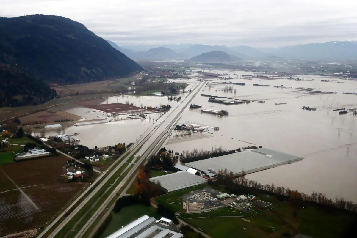 An aerial photo showing flooded farms along the Trans-Canada Highway in Abbotsford, B.C., on Nov. 22, 2021. (The Canadian Press/Darryl Dyck)