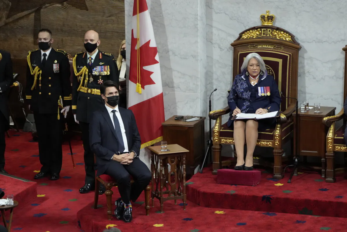 Prime Minister Justin Trudeau looks on as Gov. Gen. Mary Simon delivers the throne speech in the Senate in Ottawa on Nov. 23, 2021. (The Canadian Press/Adrian Wyld)