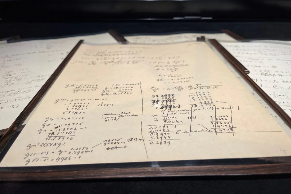 A page of the Einstein-Besso manuscript, a 54-page working manuscript written jointly by Albert Einstein and Michele Besso between June 1913 and early 1914, which documents a crucial stage in the development of the general theory of relativity, is displayed at Christie's auction house in Paris, France on Nov. 22, 2021. (Antony Paone/Reuters)