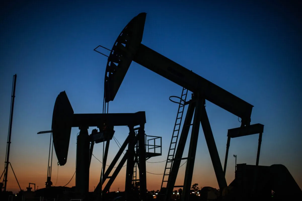 Oil pumpjacks operate at dusk Willow Springs Park in Long Beach, Calif., on April 21, 2020. (Apu Gomes/AFP via Getty Images)