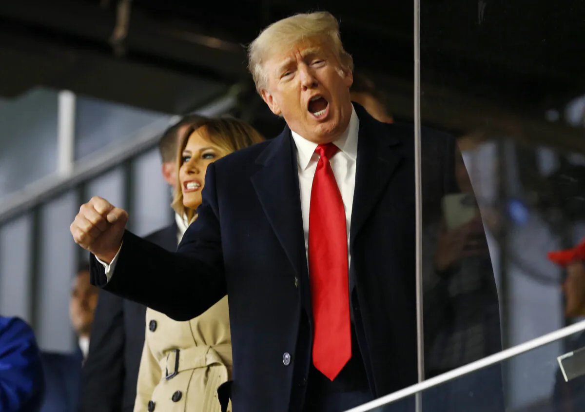 Former U.S. President Donald Trump waves prior to Game Four of the World Series between the Houston Astros and the Atlanta Braves Truist Park in Atlanta, Ga., on Oct. 30, 2021. (Michael Zarrilli/Getty Images)