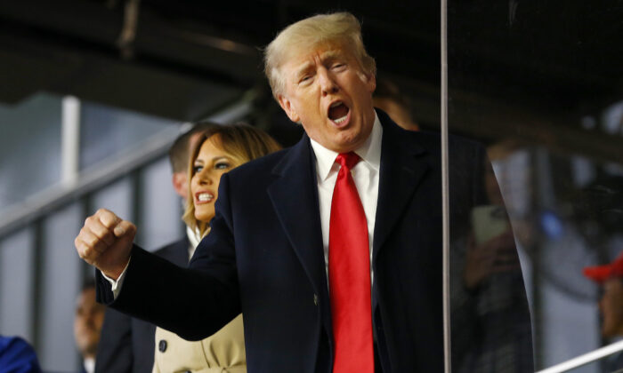 Former U.S. President Donald Trump waves prior to Game Four of the World Series between the Houston Astros and the Atlanta Braves Truist Park in Atlanta, Ga., on Oct. 30, 2021. (Michael Zarrilli/Getty Images)