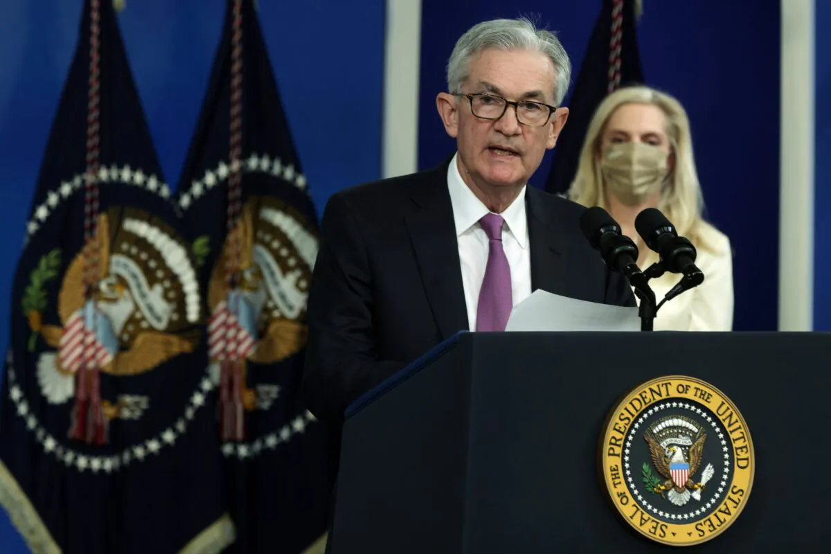 Federal Reserve Board Chair Jerome Powell (L) speaks as Lael Brainard (R) listens during an announcement at the South Court Auditorium of Eisenhower Executive Office Building in Washington on Nov. 22, 2021. (Alex Wong/Getty Images)