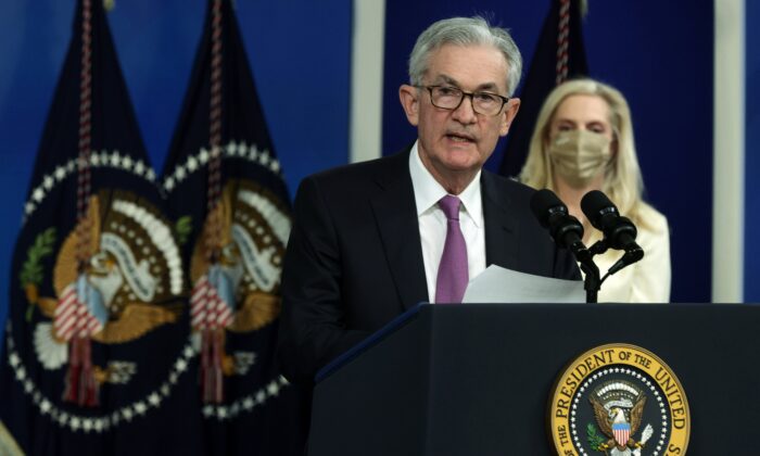 Federal Reserve Board Chair Jerome Powell (L) speaks as Lael Brainard (R) listens during an announcement at the South Court Auditorium of Eisenhower Executive Office Building in Washington on Nov. 22, 2021. (Alex Wong/Getty Images)