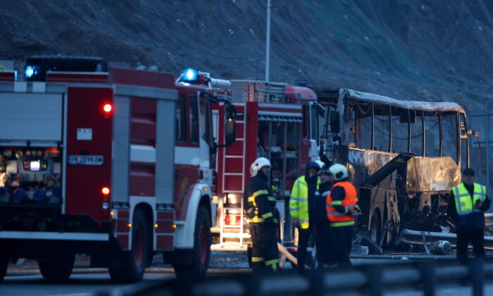 A view shows the site where a bus with North Macedonian plates caught fire on a highway, near the village of Bosnek, Bulgaria, on Nov. 23, 2021. (Stoyan Nenov/Reuters)