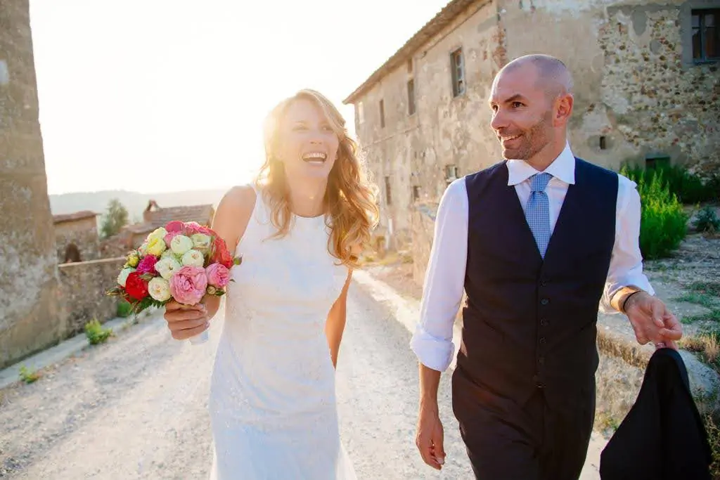 Candace Criscione traveled to Sicily in search of her relatives and family history. She now lives in Tuscany with ther Italian husband and their three sons. Above, Candace and her husband on their wedding day in Tuscany in 2013. (Courtesy of Candace Criscione)