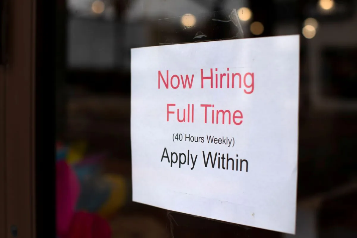 A retail store advertising a full time job on its shop window in Oceanside, Calif., on May 10, 2021. (Mike Blake/Reuters)