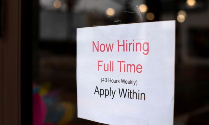A retail store advertising a full time job on its shop window in Oceanside, Calif., on May 10, 2021. (Mike Blake/Reuters)