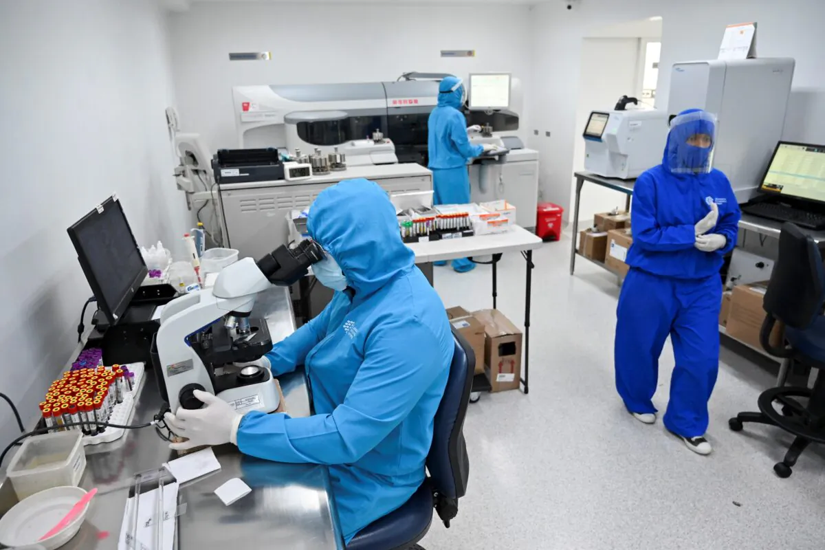 Health personnel work at the COVID-19 area in a file photo. (Luis Robayo/AFP via Getty Images)