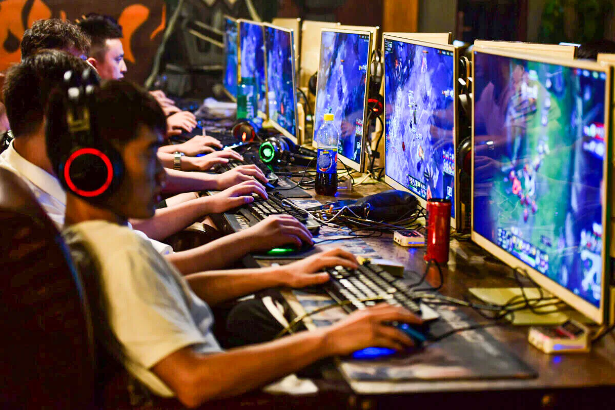 People play online games at an internet cafe in Fuyang, Anhui province, China, on Aug. 20, 2018. (Reuters/Stringer)