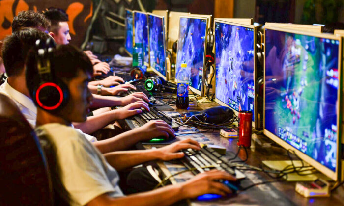 People play online games at an internet cafe in Fuyang, Anhui Province, China, on Aug. 20, 2018. (Reuters/Stringer)