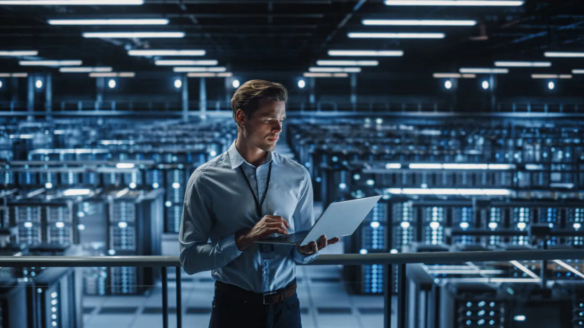 A cyber security specialist at a data center. (Gorodenkoff/Adobe Stock)