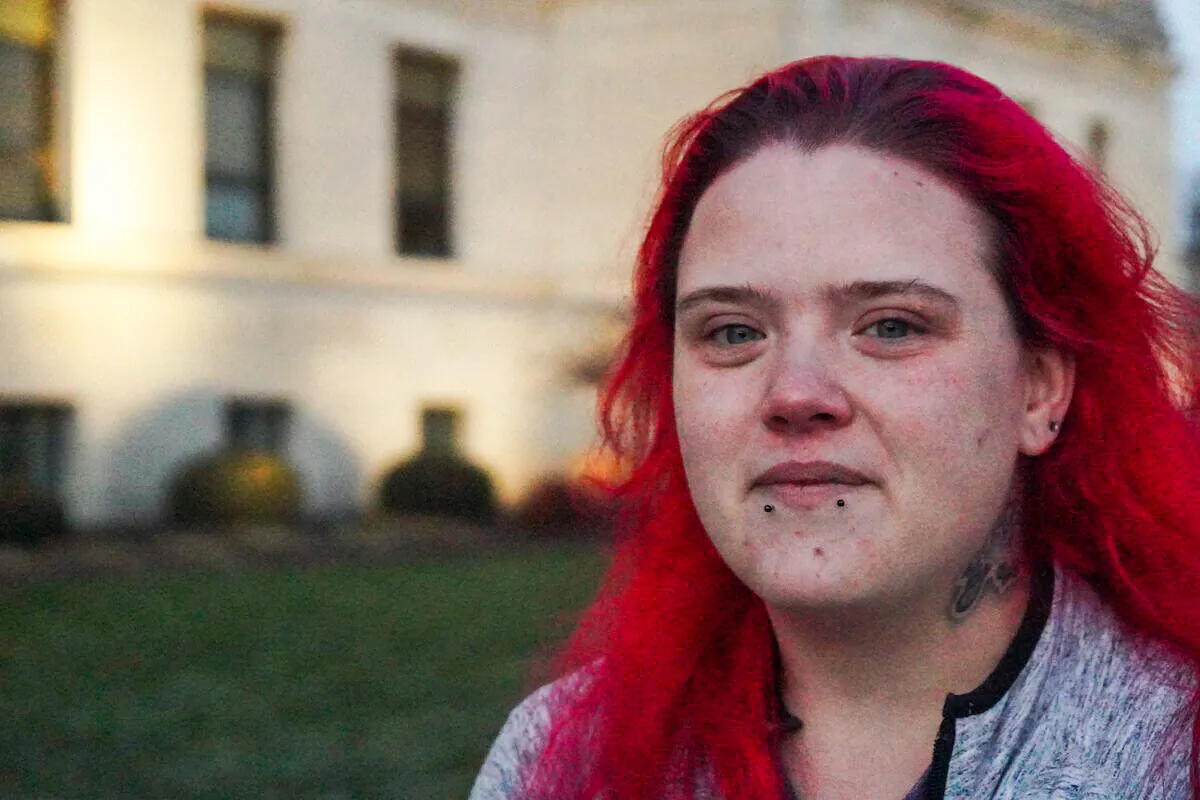 Annie Hysell, a friend of Anthony Huber, grieves outside the Kenosha County Courthouse in Kenosha, Wisconsin on Nov. 19, 2021 (Jackson Elliott/The Epoch Times)