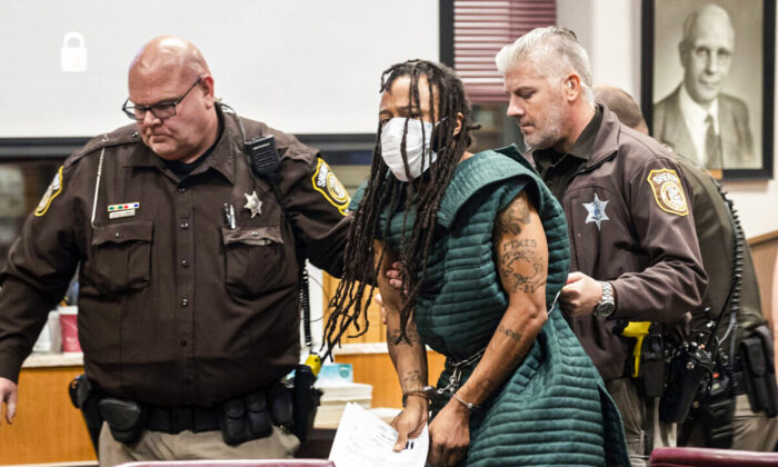 Darrell Brooks is escorted out of the courtroom after making his initial appearance in Waukesha County Court in Waukesha, Wis., on Nov. 23, 2021. (Mark Hoffman/Pool/Milwaukee Journal-Sentinel via AP)