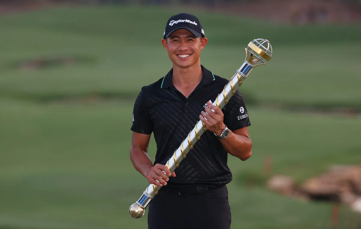 Collin Morikawa of the United States poses with The DP World Tour Championship trophy after winning The DP World Tour Championship at Jumeirah Golf Estates in Dubai, United Arab Emirates, on Nov. 21, 2021. (Andrew Redington/Getty Images)