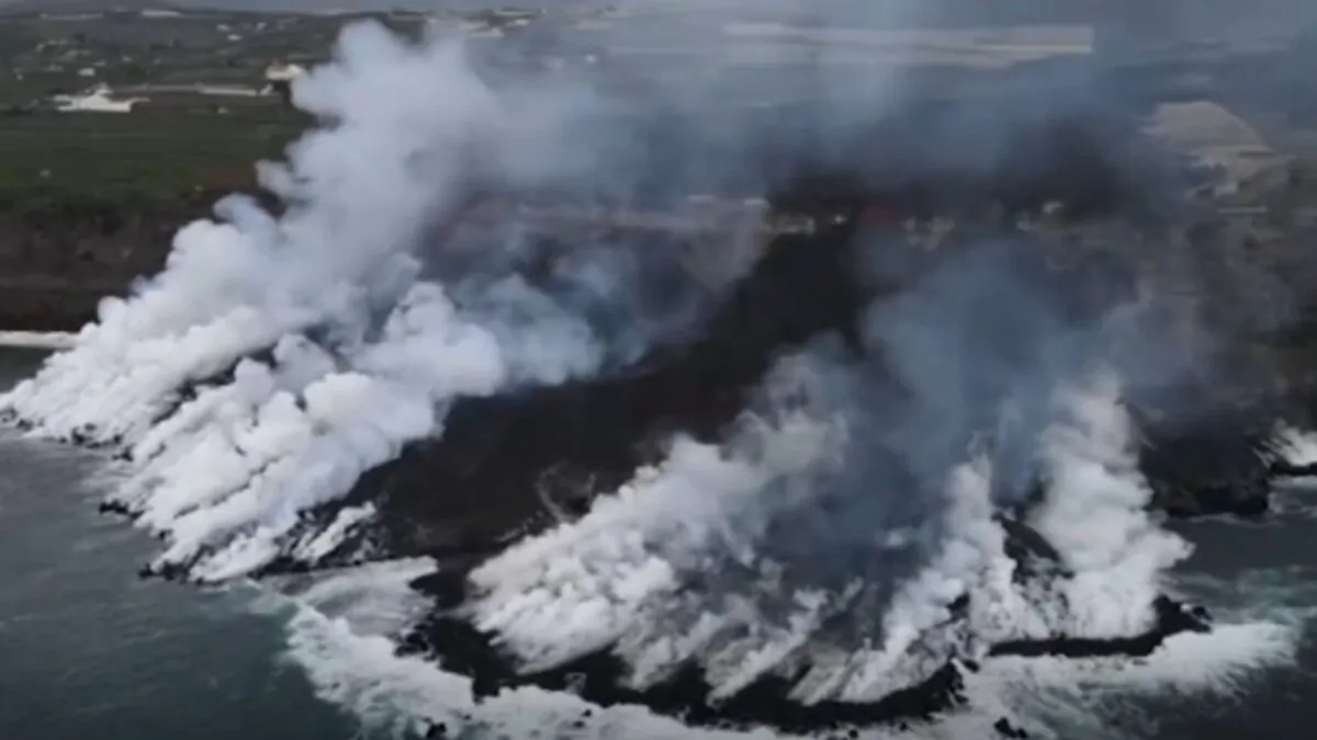 Aerial shot of lava plunging into Atlantic Ocean, from the volcano on the Spanish island of La Palma, in a still image from real-time camera footage released by AP. (Spanish Institute of Mining And Geology via AP/Screenshot via The Epoch Times)