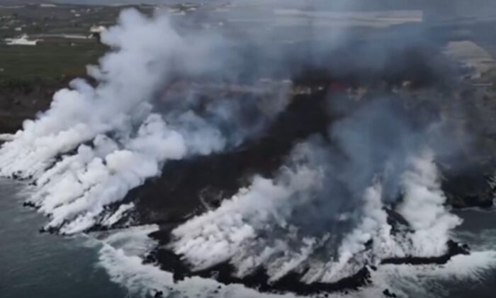 Aerial shot of lava plunging into Atlantic Ocean, from the volcano on the Spanish island of La Palma, in a still image from real-time camera footage released by AP. (Spanish Institute of Mining And Geology via AP/Screenshot via   Pezou)