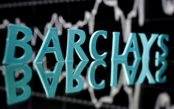 The Barclays logo seen in front of the displayed stock price graph