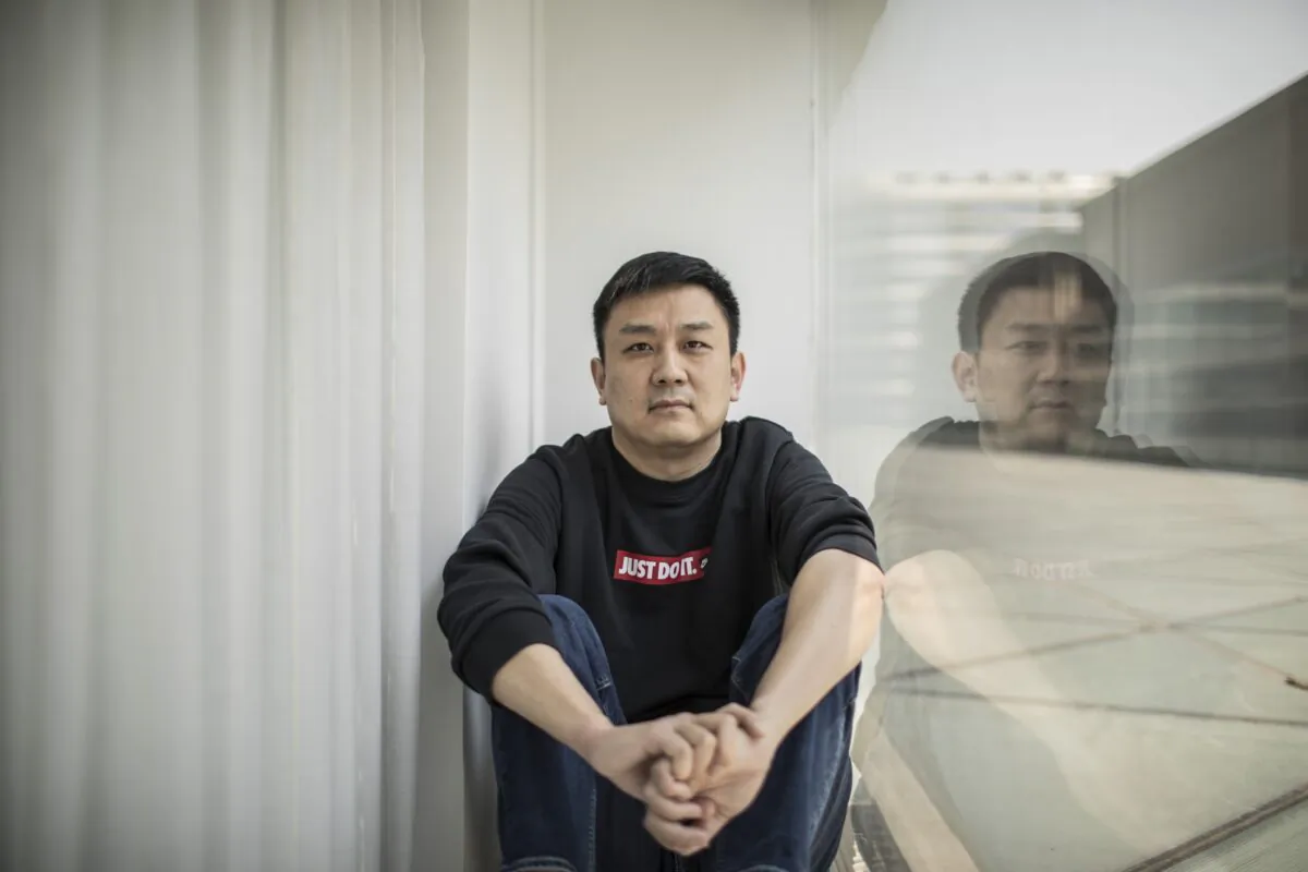U.S. citizen Daniel Hsu poses for a portrait in the apartment in Shanghai, China, April 13, 2020.   (AP Photo, File)