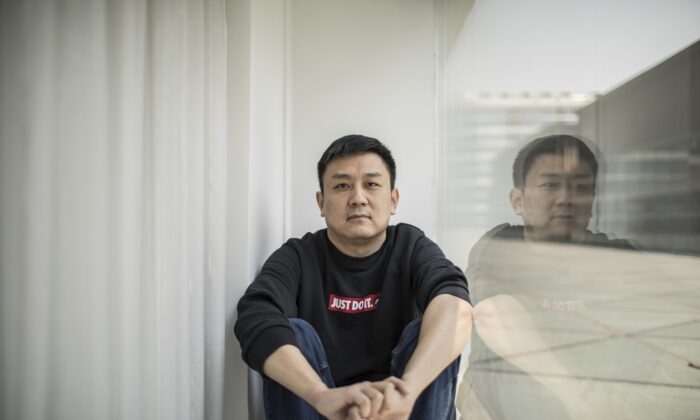 U.S. citizen Daniel Hsu poses for a portrait in the apartment in Shanghai, China, April 13, 2020.   (AP Photo, File)
