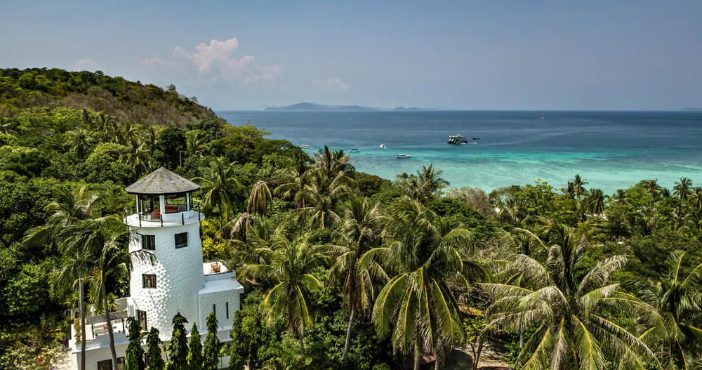 Lush vegetation and turquoise waters make for a beautiful backdrop at The Racha. (fivetonine/Shutterstock)