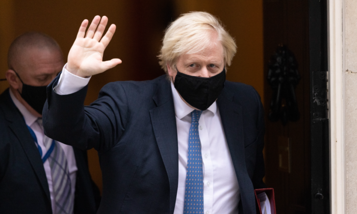 Prime Minister Boris Johnson leaves Downing Street to attend the weekly Prime Ministers Questions in Parliament in London on Nov. 24, 2021. (Dan Kitwood/Getty Images)