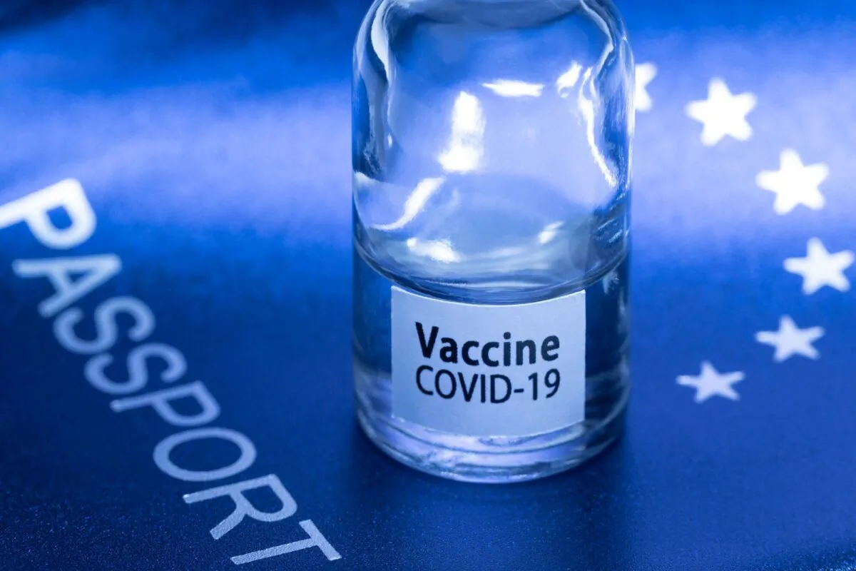 A vaccine vial on a European passport in Paris, France, on March 3, 2021. (Joel Saget/AFP via Getty Images)