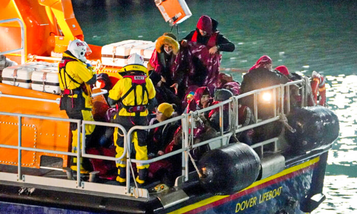 A group of people thought to be migrants are brought in to Dover, Kent, by the Royal National Lifeboat Institution on Nov. 25, 2021. (Gareth Fuller/PA)
