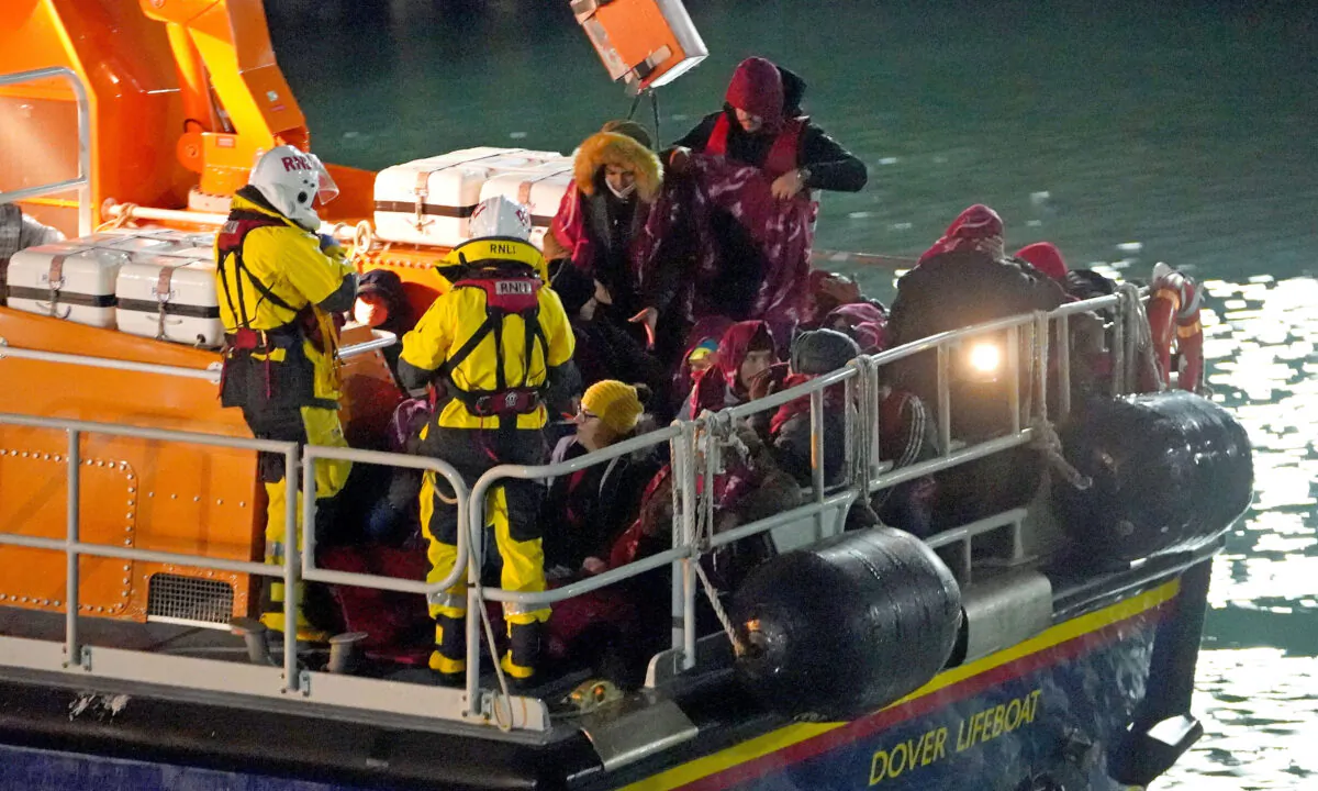 A group of people thought to be migrants are brought in to Dover, Kent, by the Royal National Lifeboat Institution on Nov. 25, 2021. (Gareth Fuller/PA)