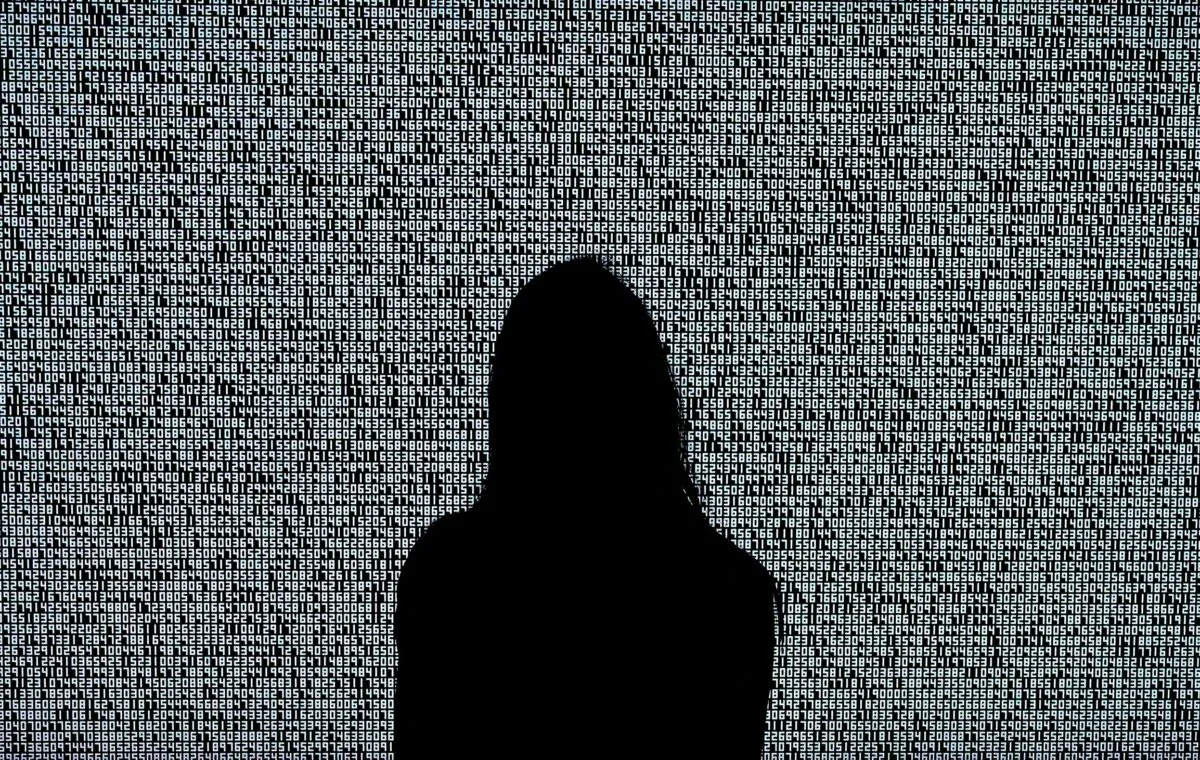 A woman looks at a NFT by Ryoji Ikeda titled "A Single Number That Has 10,000,086 Digits" during a media preview at Sotheby's in New York on June 4, 2021. (Timothy A. Clary/AFP via Getty Images)