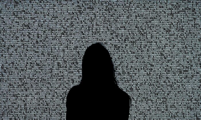 A woman looks at a NFT by Ryoji Ikeda titled "A Single Number That Has 10,000,086 Digits" during a media preview at Sotheby's in New York on June 4, 2021. (Timothy A. Clary/AFP via Getty Images)