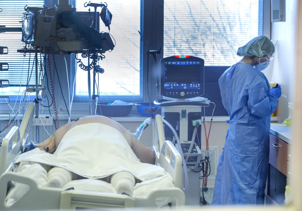 Medical staff attend to a patient at the COVID-19 ICU unit of the hospital in Bratislava, Slovakia, on Nov. 23, 2021. (Martin Baumann/TASR via AP)